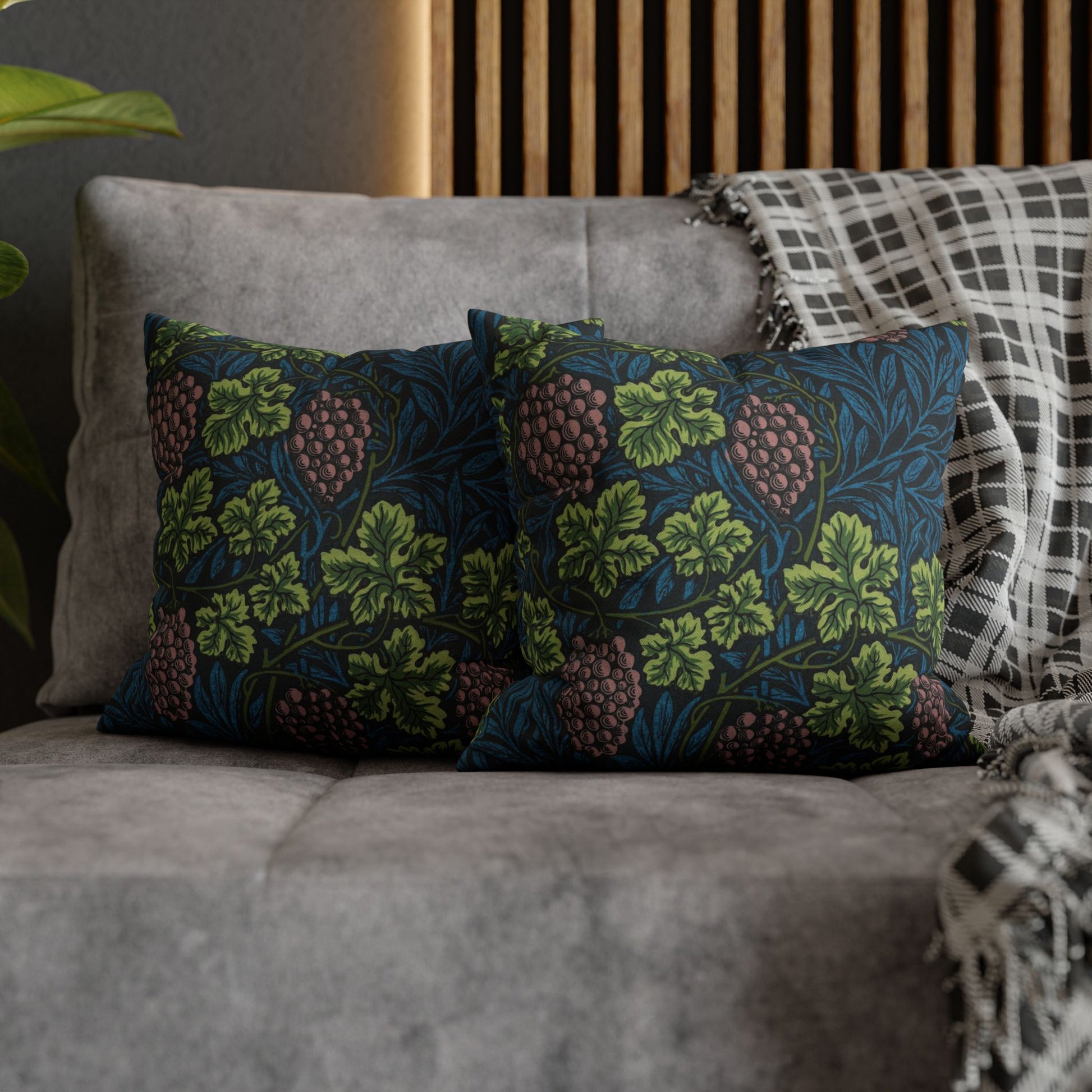Decorative pillows with floral pattern on a gray sofa
