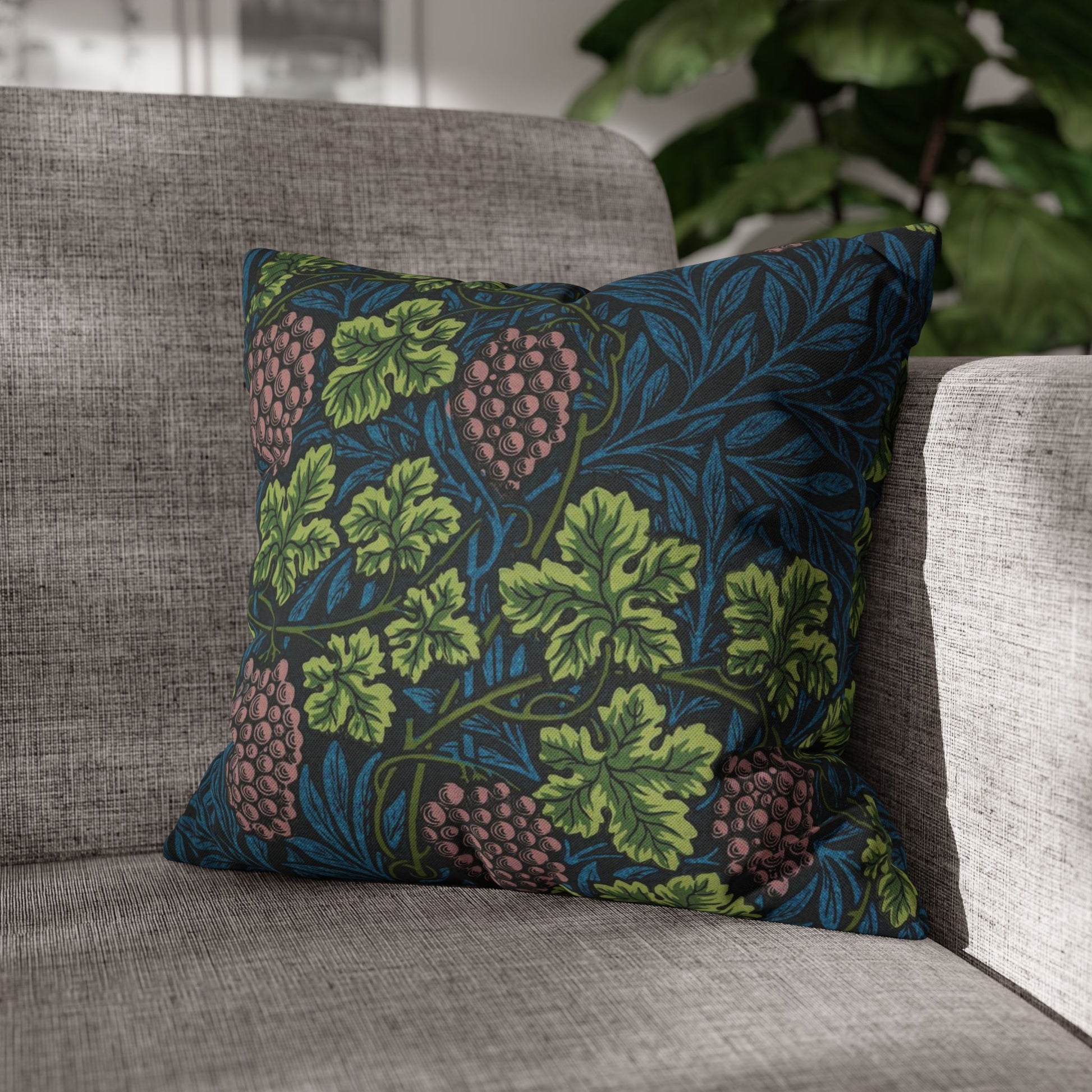 Decorative pillow with leaf pattern on a gray sofa
