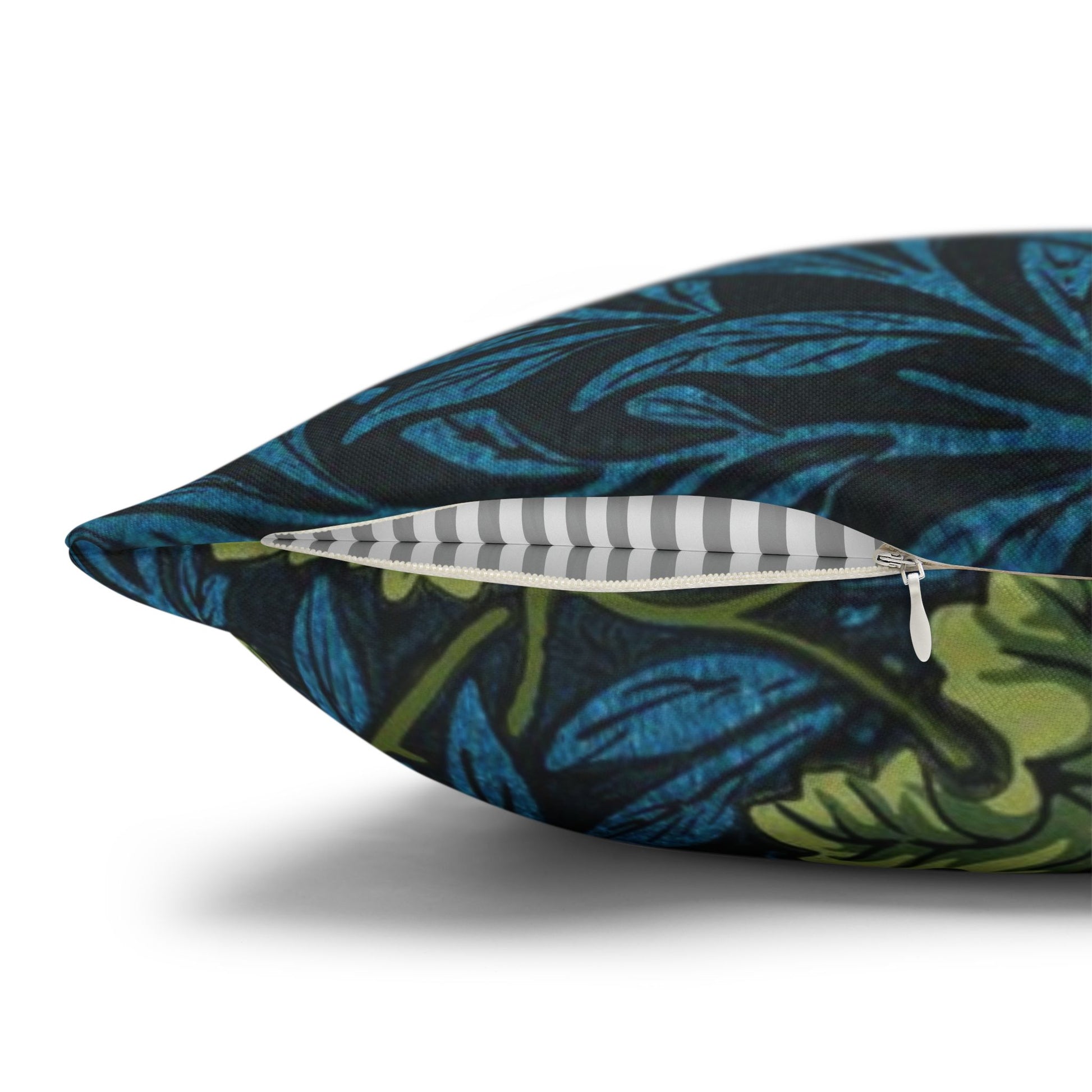 Floral-patterned pillow with a zipper on a white background