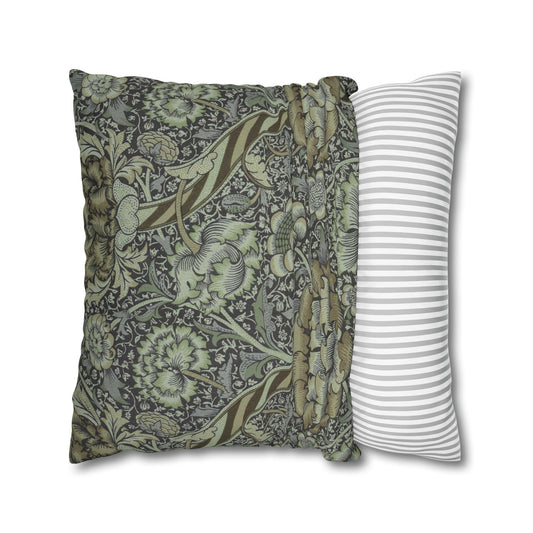 Two pillows, one with floral pattern and one with stripes, on a white background