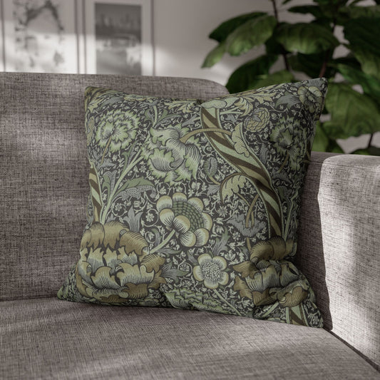 Decorative pillow with floral pattern on a gray sofa