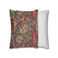 Decorative pillow with floral pattern next to a striped pillow on a white background