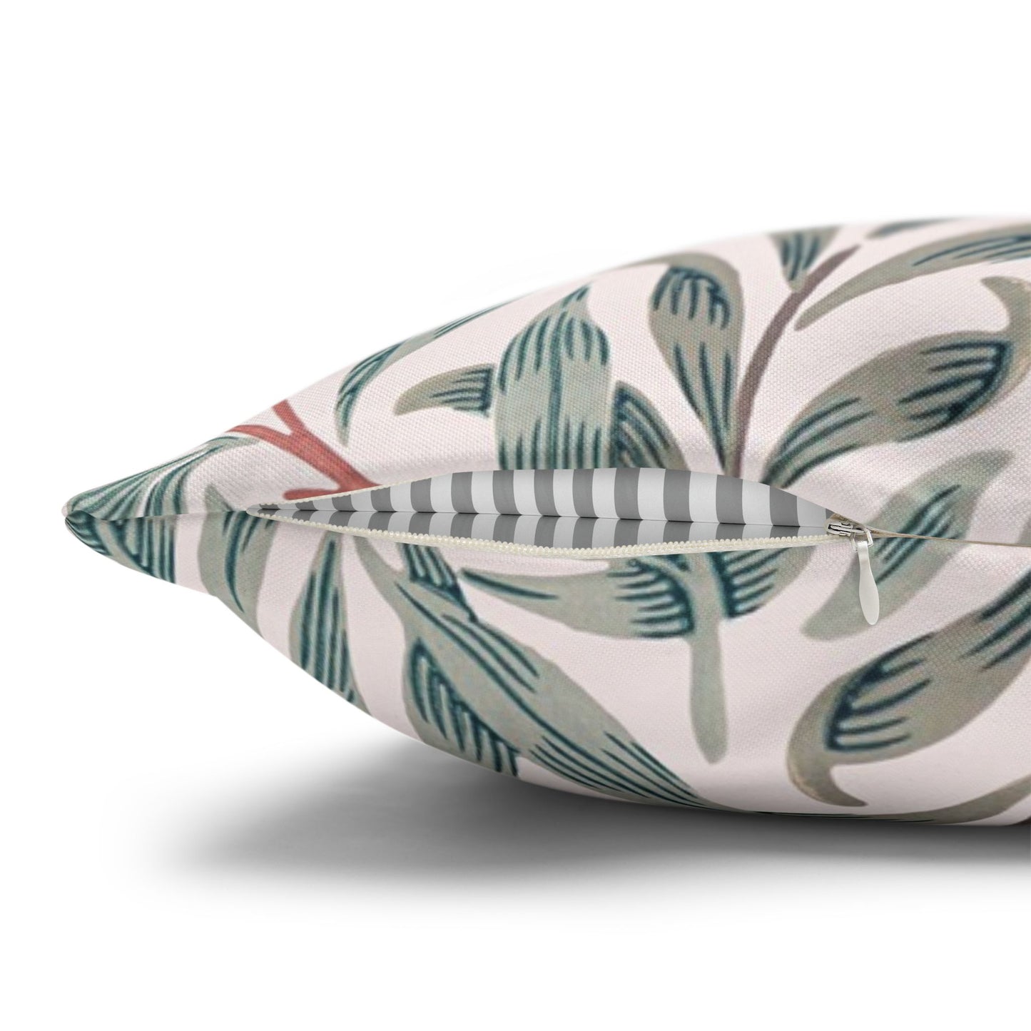 Decorative pillow with leaf pattern on a white background