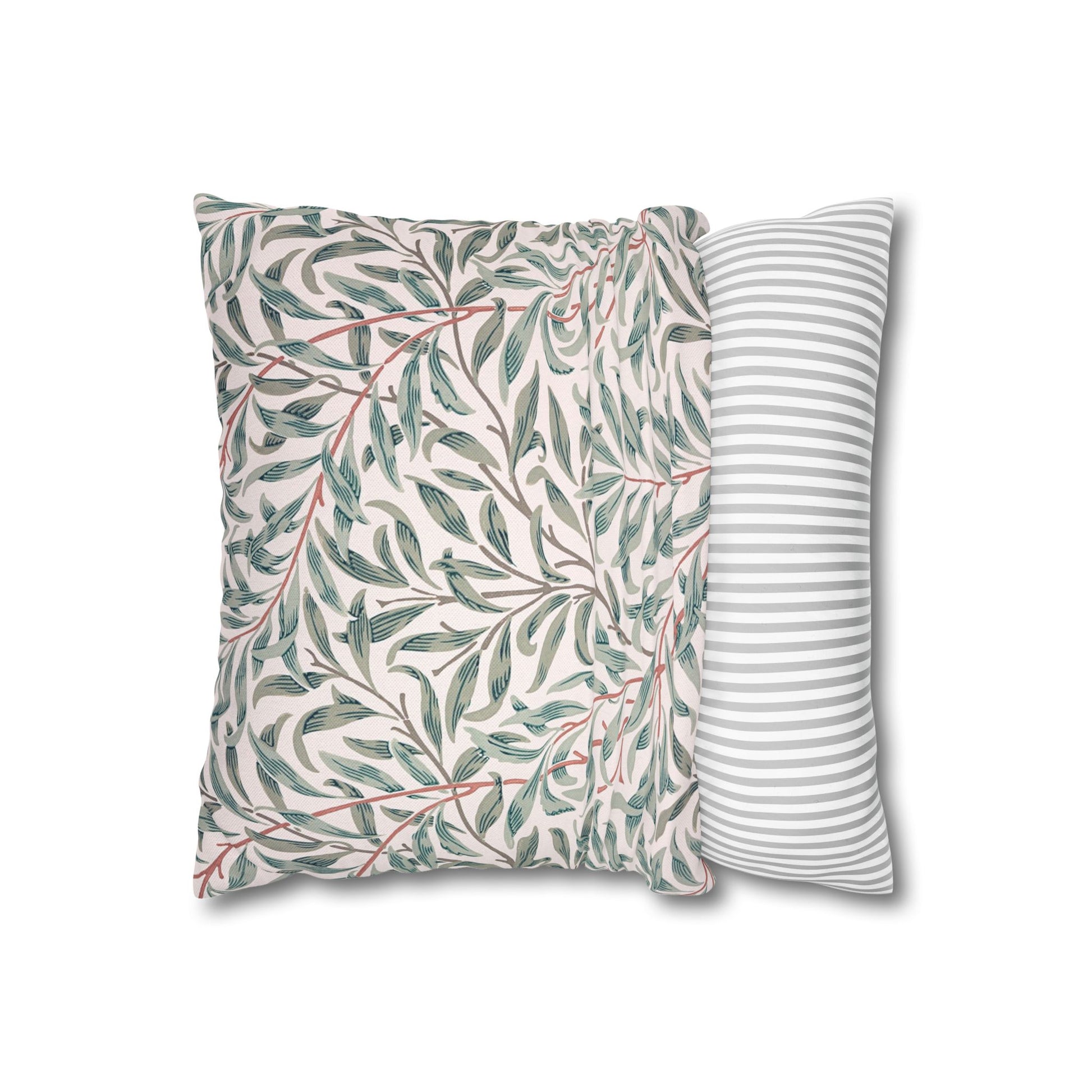 Two pillows, one with a leaf pattern and the other with a striped pattern, on a white background.