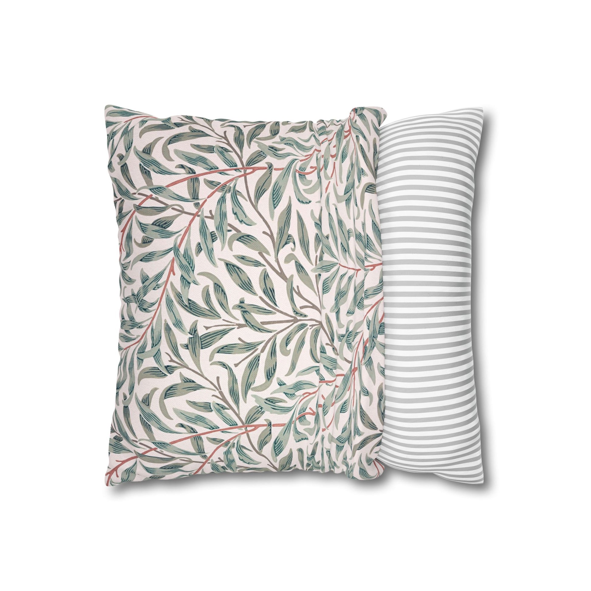 Two pillows, one with a leaf pattern and the other with a striped pattern, on a white background.