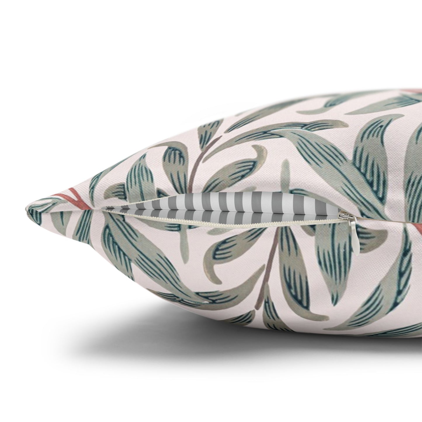 Decorative pillow with leaf pattern on a white background