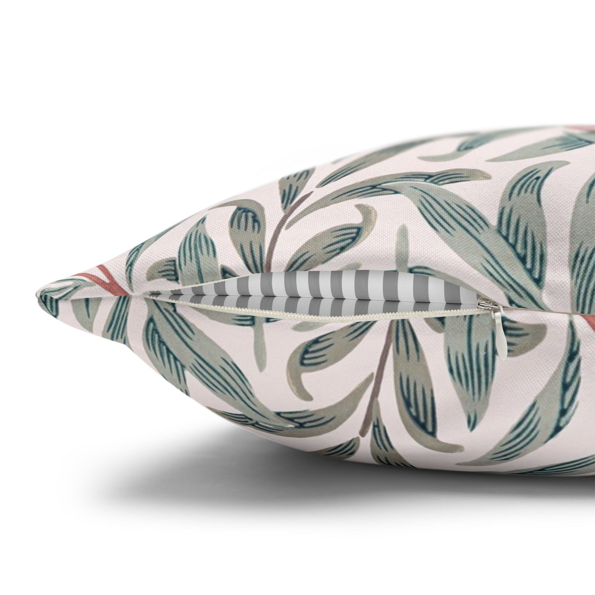 Decorative pillow with leaf pattern on a white background