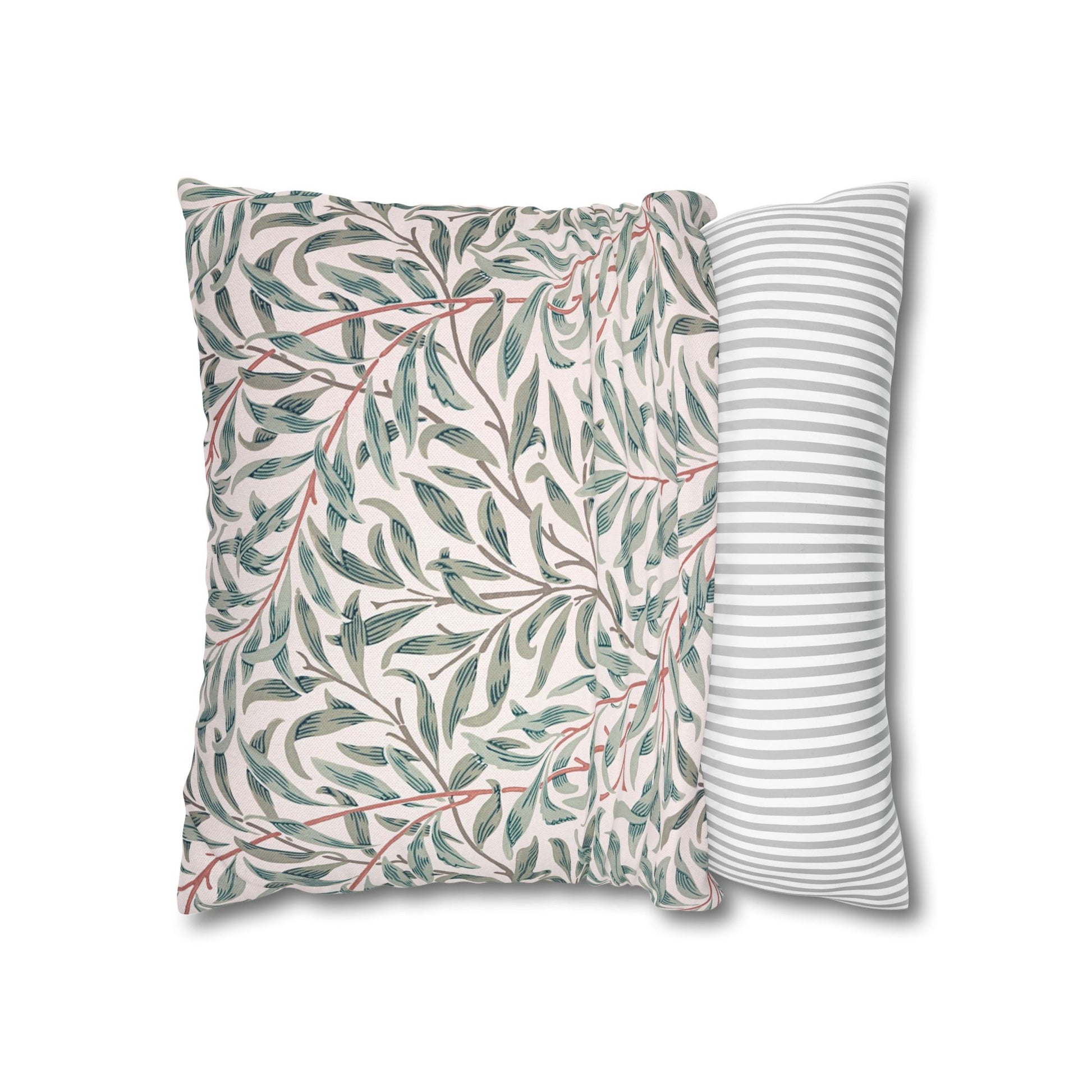 Two pillows, one with a leaf pattern and the other with a striped pattern, on a white background.