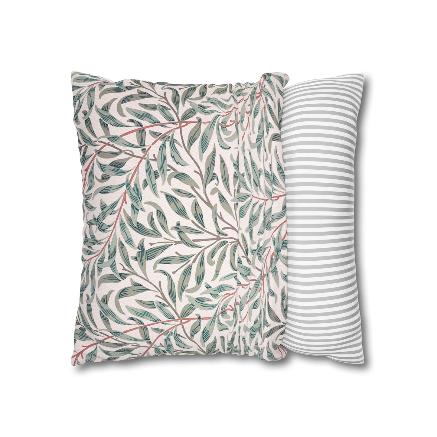Two pillows, one with a leaf pattern and the other with stripes, on a white background.