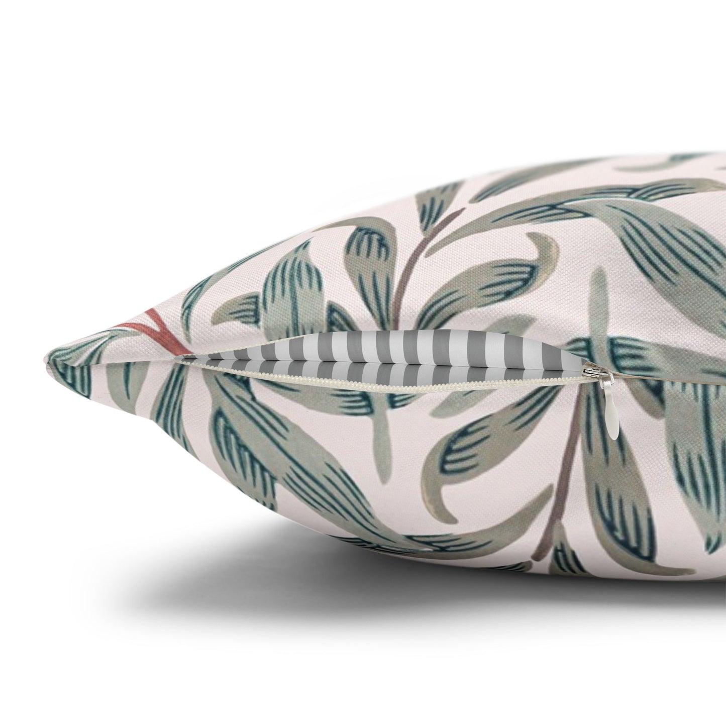 Decorative pillow with leaf pattern on a white background
