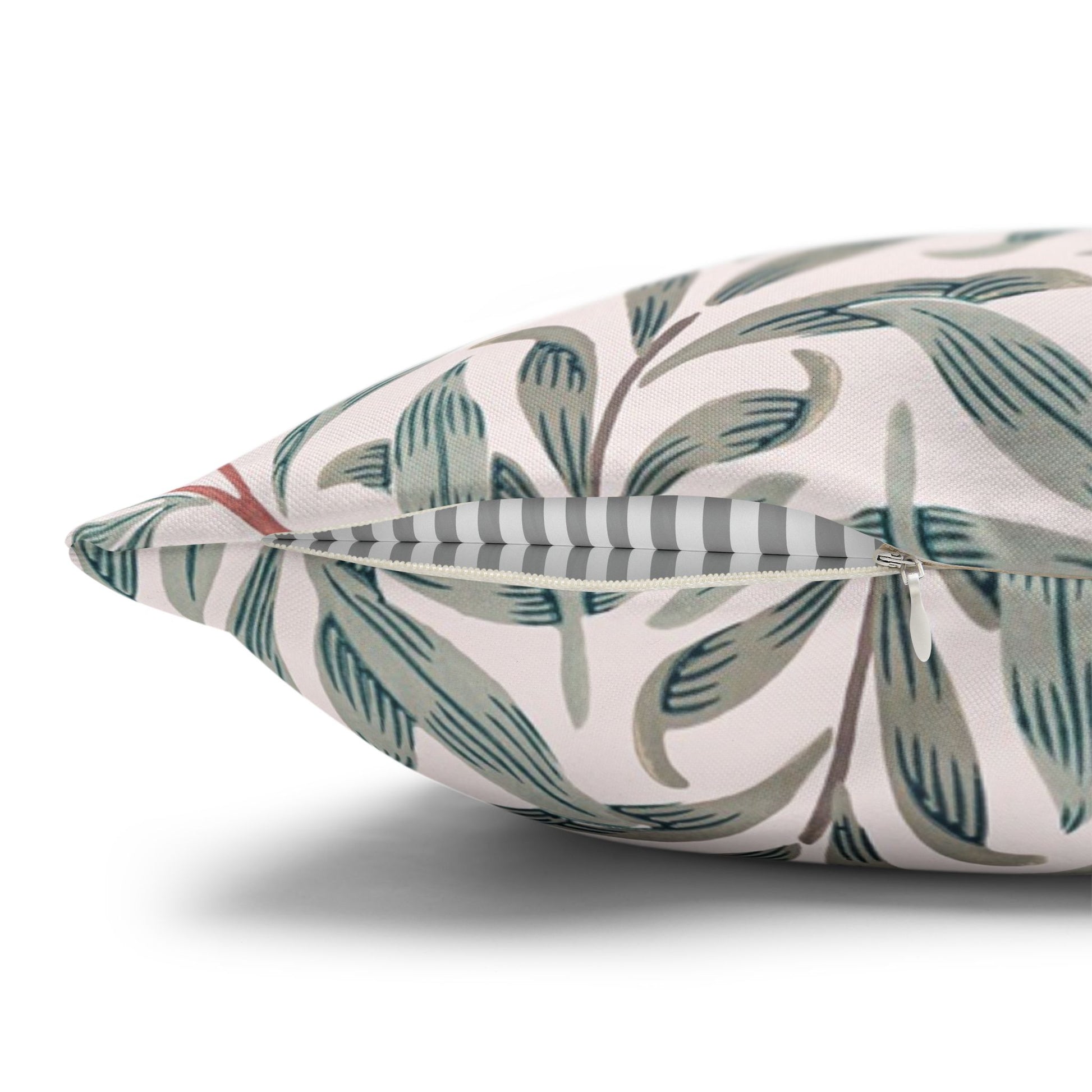 Decorative pillow with leaf pattern on a white background