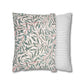 Two pillows, one with a leaf pattern and one with a striped pattern, on a white background.