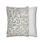 Two pillows, one with a leaf pattern and the other with a striped design, on a white background.