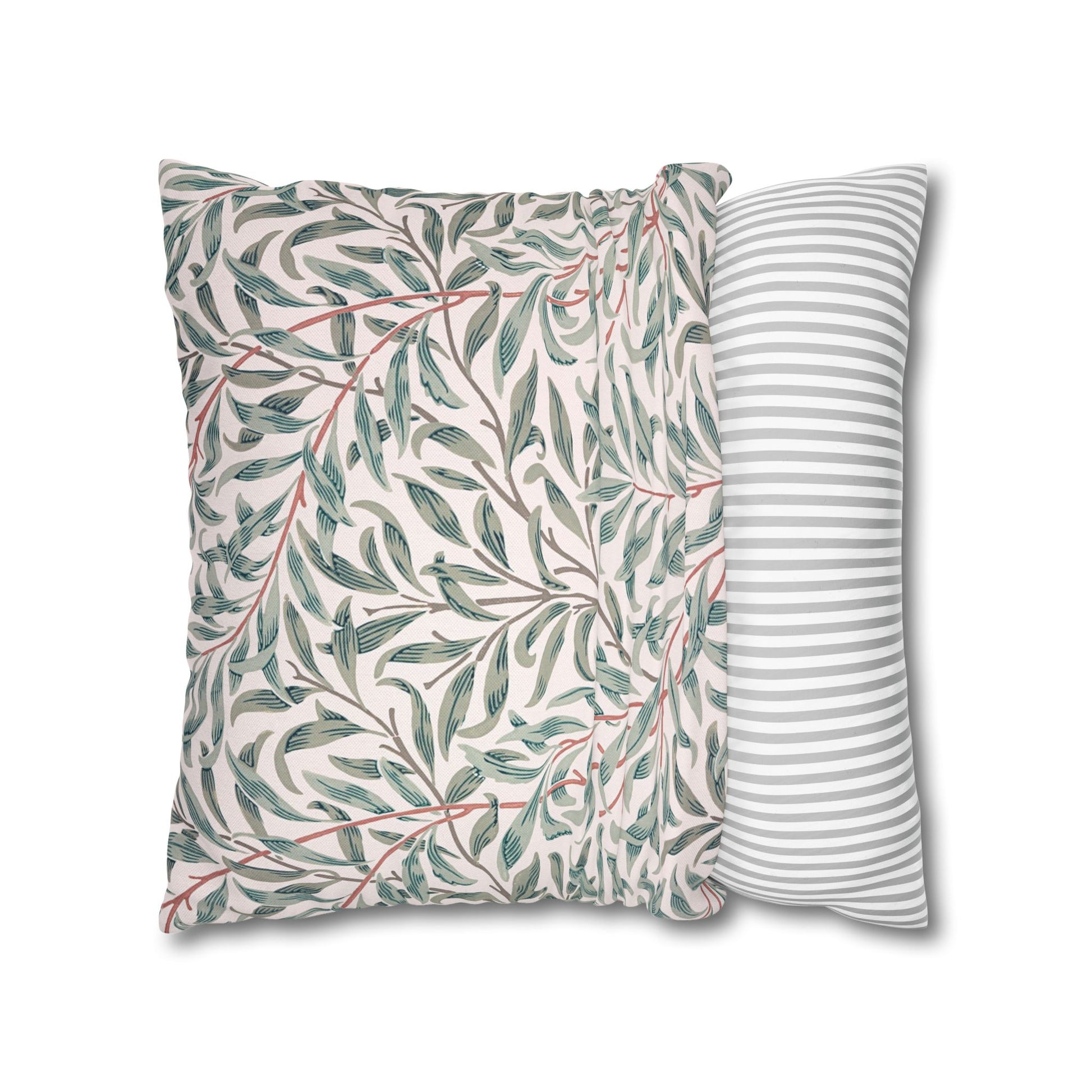 Two pillows, one with a leaf pattern and the other with a striped design, on a white background.