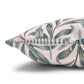 Decorative pillow with leaf pattern on a white background