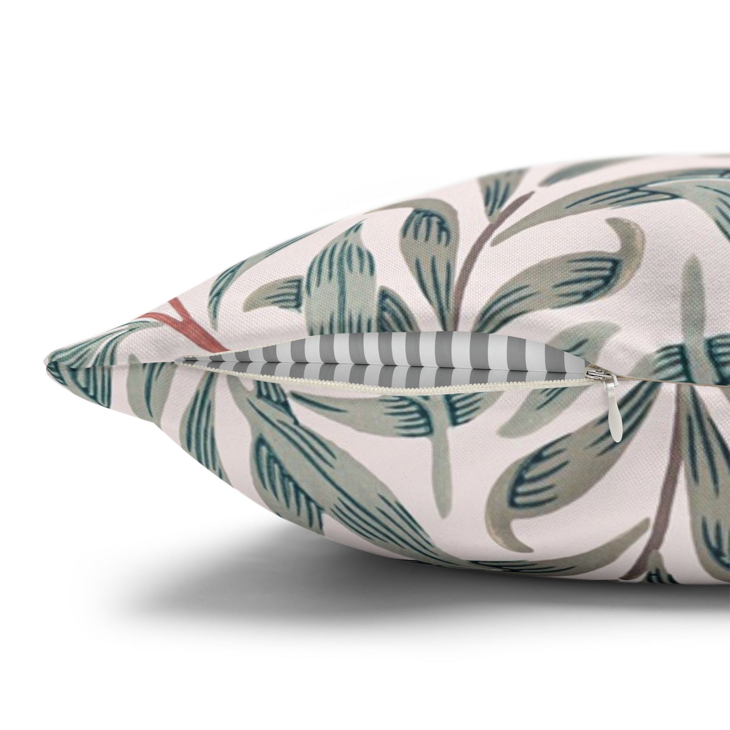 Decorative pillow with leaf pattern on a white background
