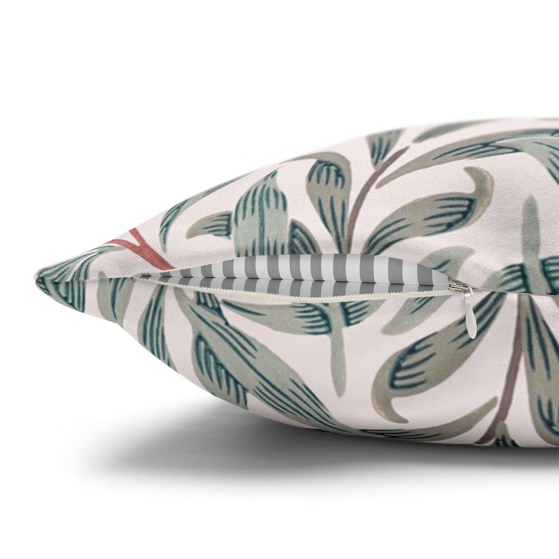 Decorative pillow with leaf pattern on a white background