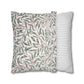 Two pillows with leaf pattern and striped design on a white background
