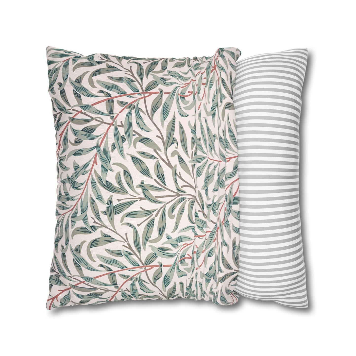 Two pillows with leaf pattern and striped design on a white background