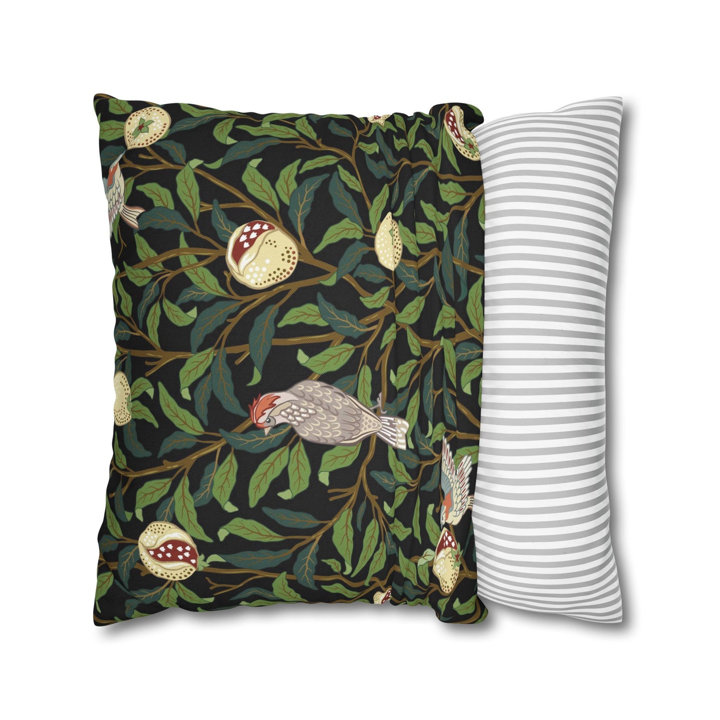 Decorative pillow with nature-themed design and a striped pillow next to it on a white background