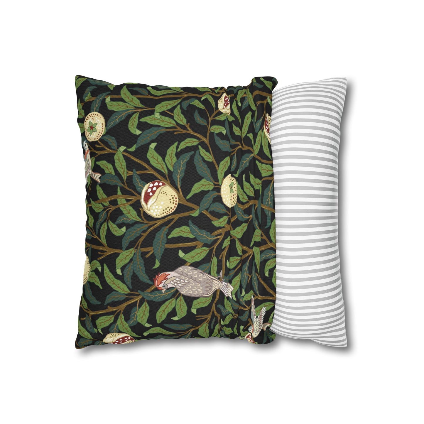 Decorative pillow with nature-themed design and a plain striped pillow next to it on a white background.