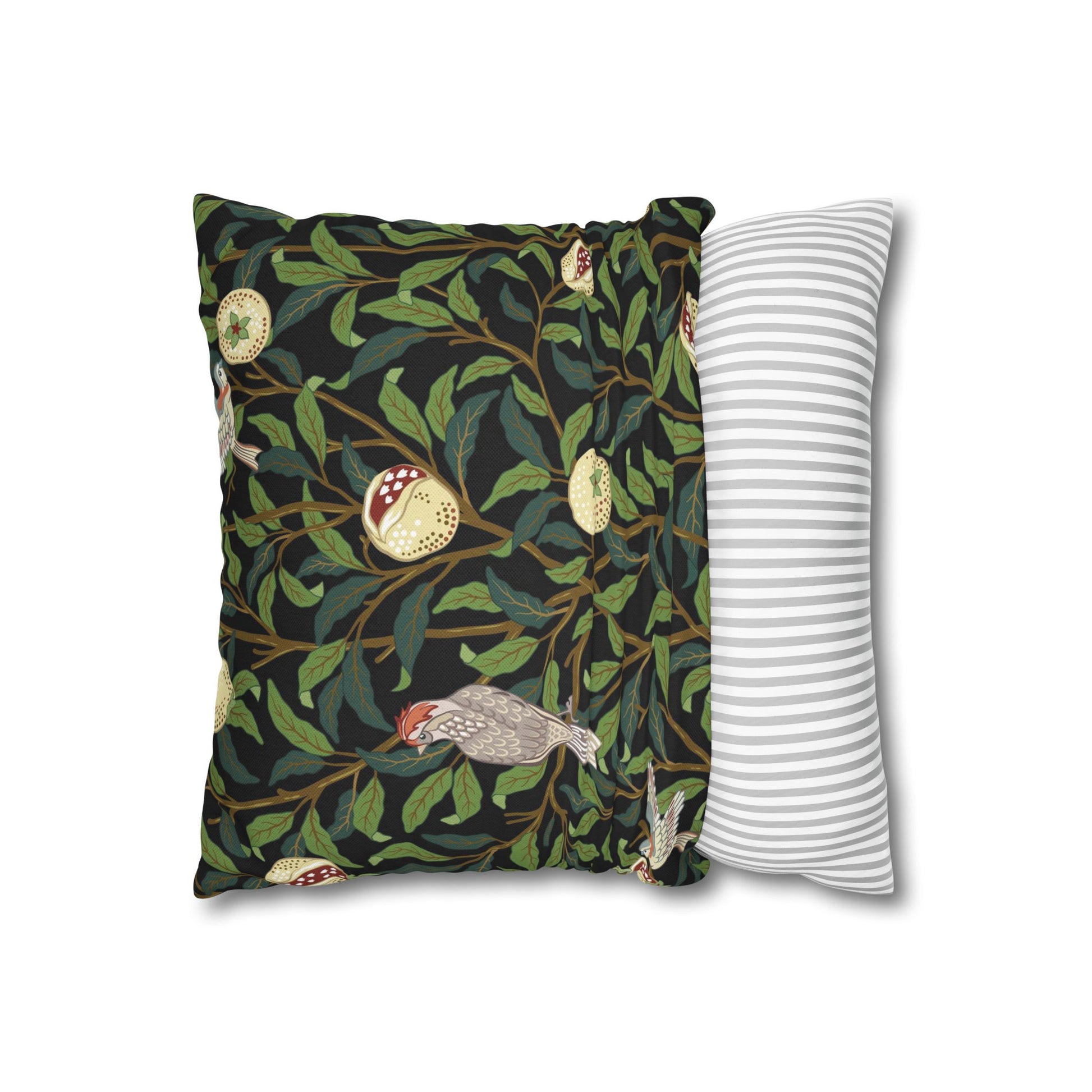 Decorative pillow with nature-themed design and a plain striped pillow next to it on a white background.