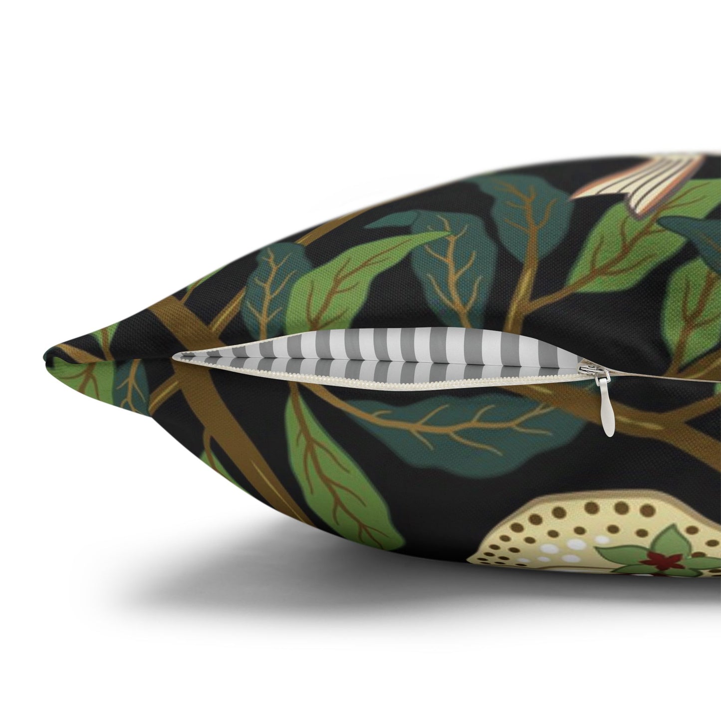 Decorative pillow with leaf pattern on a black background