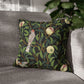 Decorative pillow with nature-themed design on a gray sofa