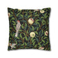 Decorative pillow with nature-themed design featuring birds and leaves on a black background
