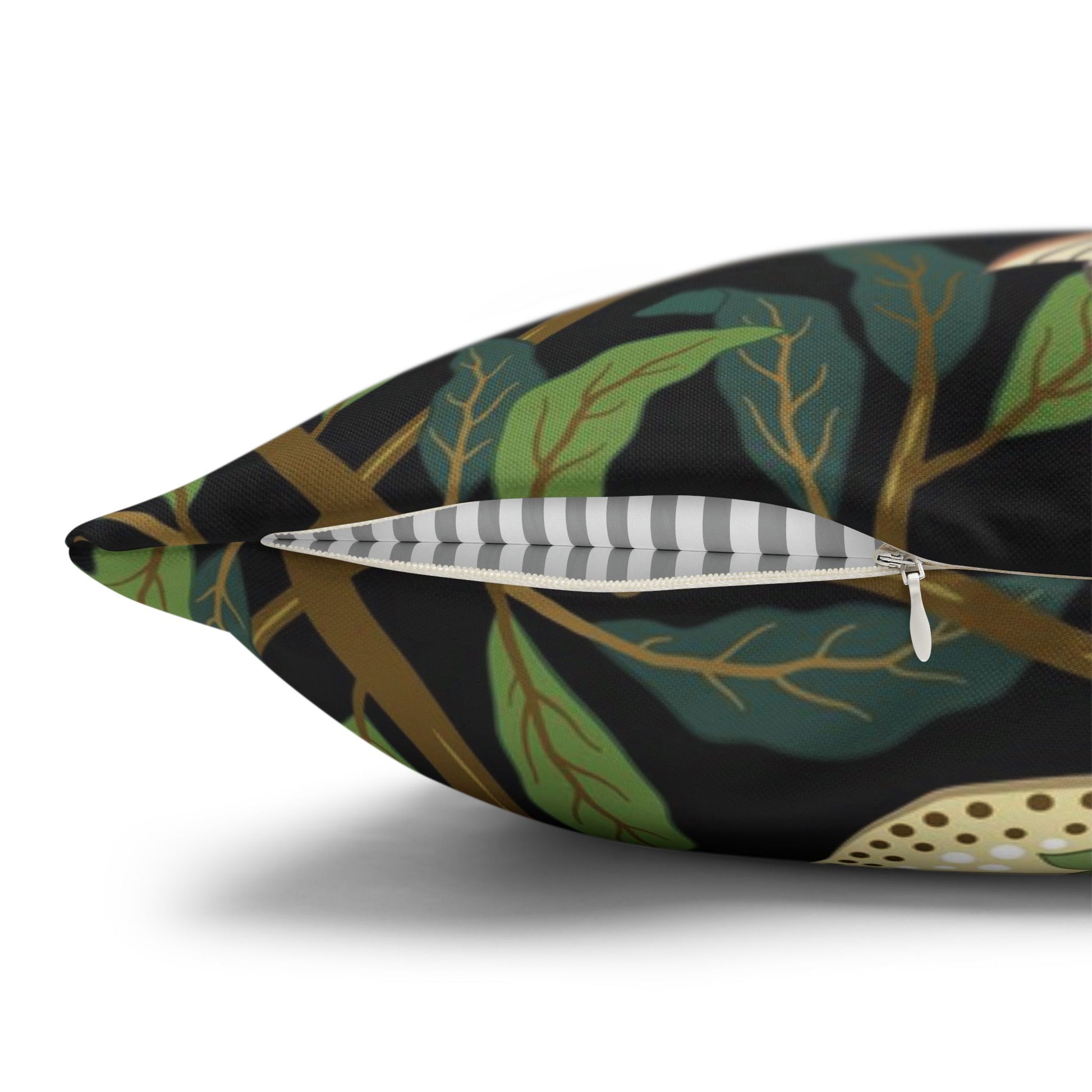 Decorative pillow with leaf pattern and zipper on a white background