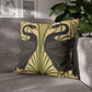 Decorative pillow with bird design on a gray sofa