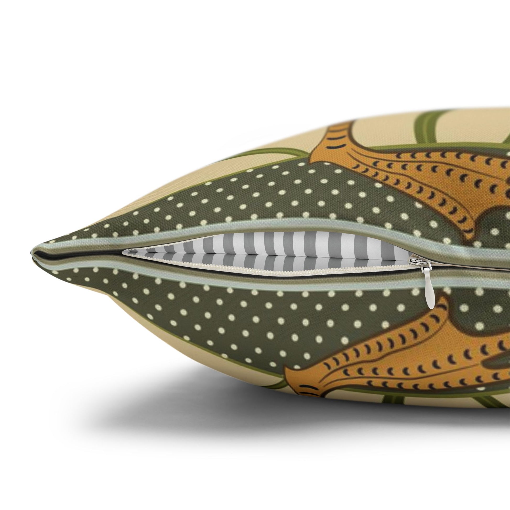 Decorative pillow with polka dot pattern and tribal design on a white background