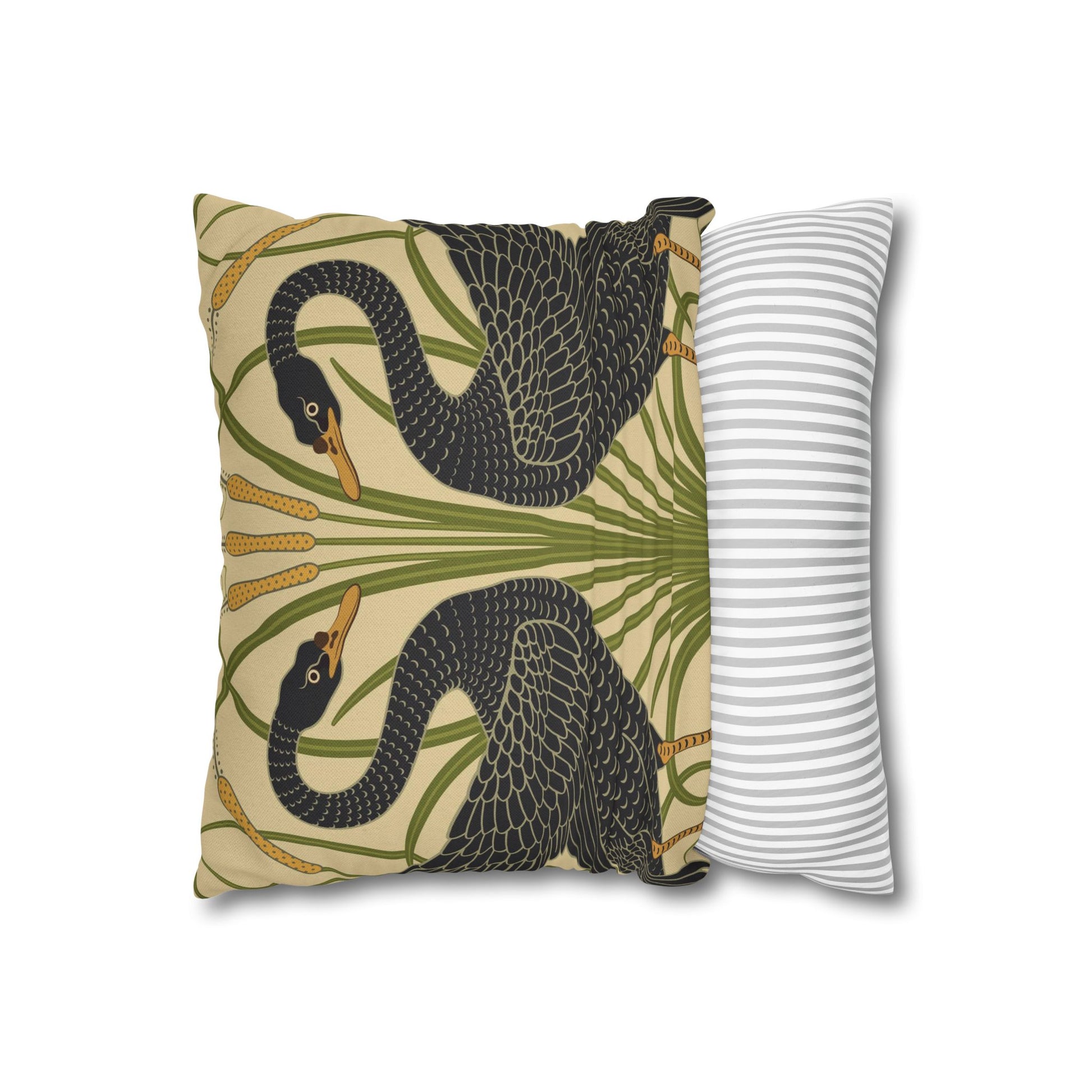 Decorative pillow with swan design on one side and striped pattern on the other, on a white background.