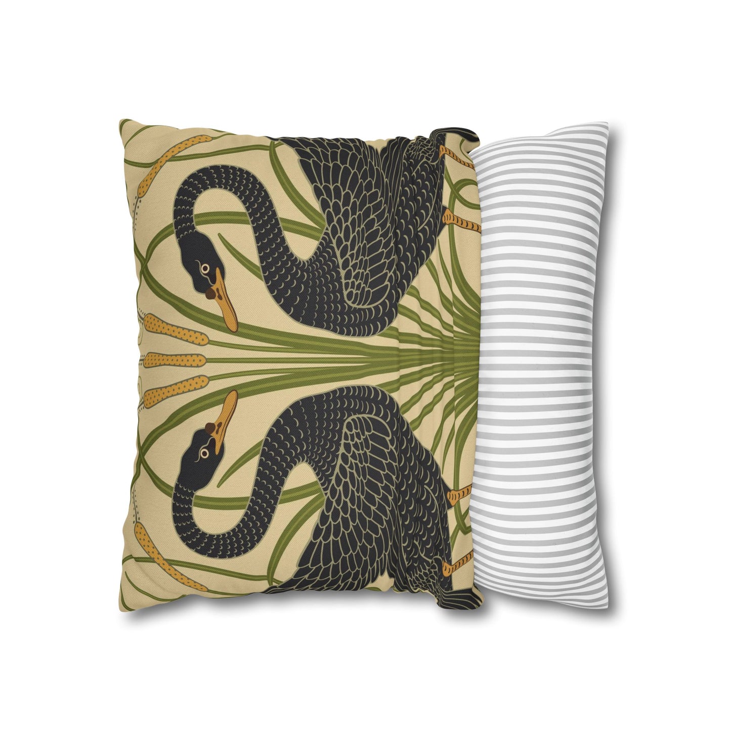 Decorative pillow with snake and palm leaf pattern next to a striped pillow on a white background