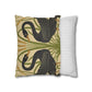 Decorative pillow with snake design next to a striped pillow on a white background