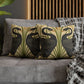 Decorative pillows with bird pattern on a gray sofa