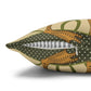 Decorative pillow with a polka dot pattern and a zipper on a white background