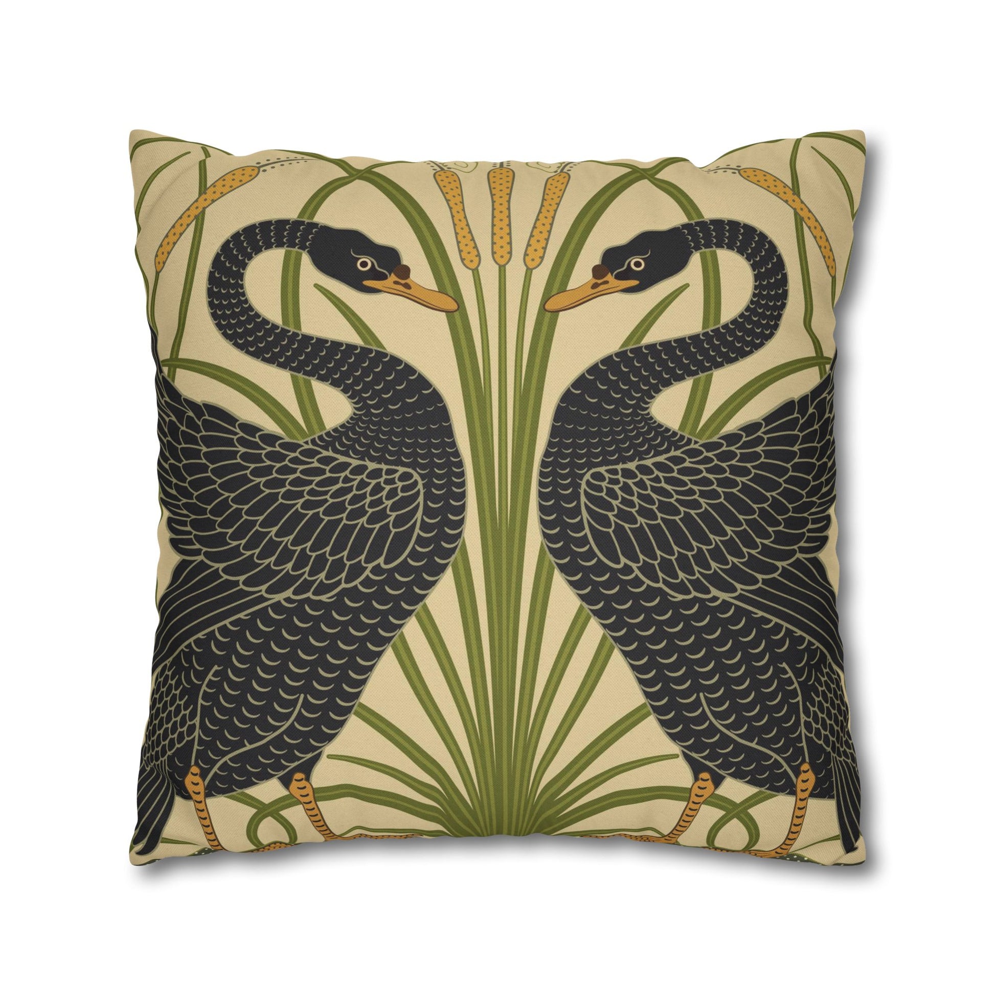 Decorative pillow with two black birds and green plants on a beige background