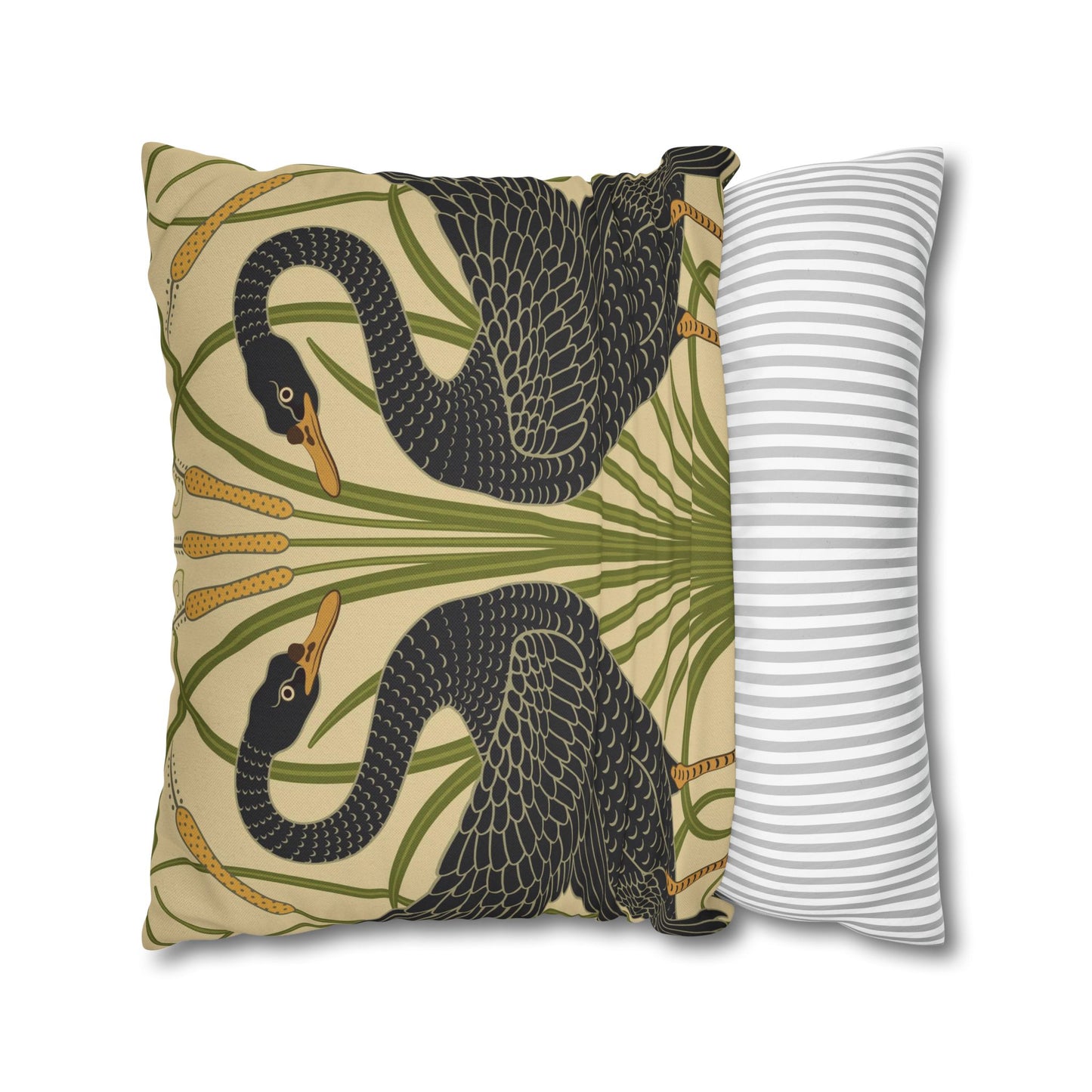 Decorative pillow with swan design next to a striped pillow on a white background