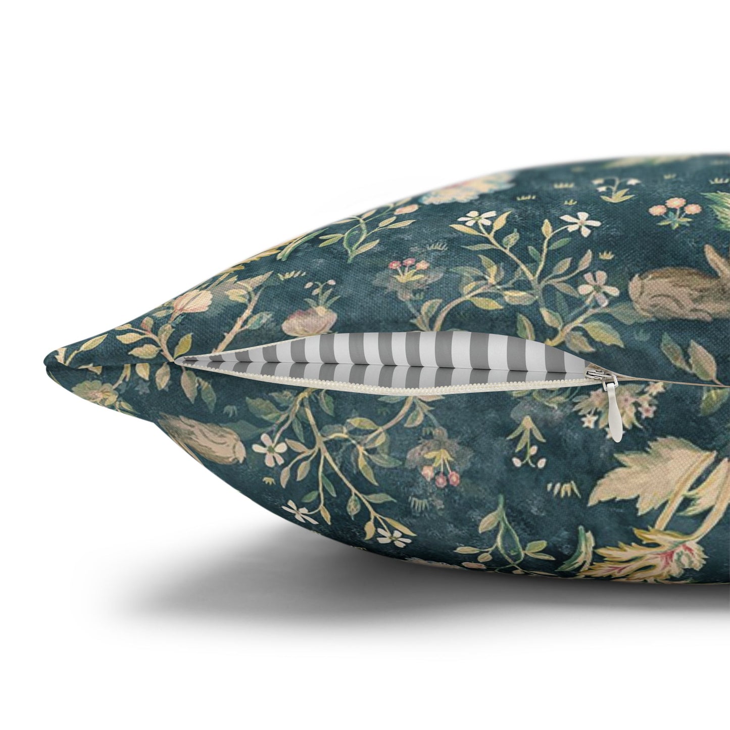 Decorative pillow with floral and animal pattern on a white background