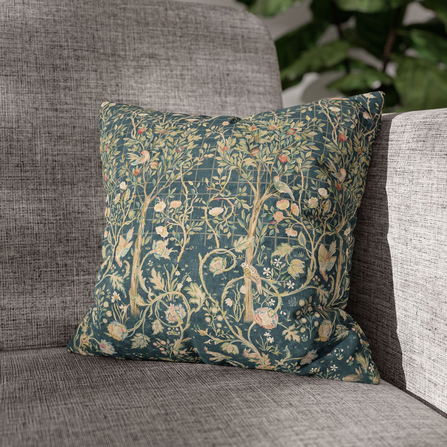 Decorative pillow with floral pattern on a gray sofa