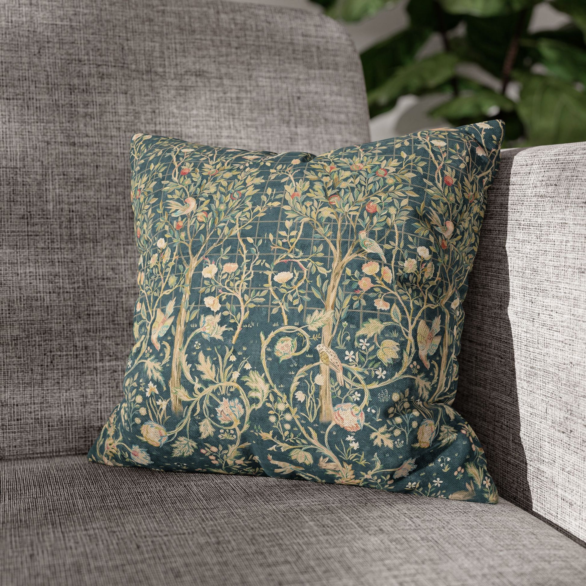 Decorative pillow with floral pattern on a gray sofa