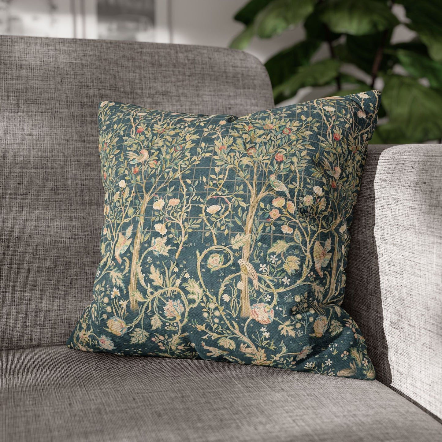 Decorative pillow with floral pattern on a gray sofa