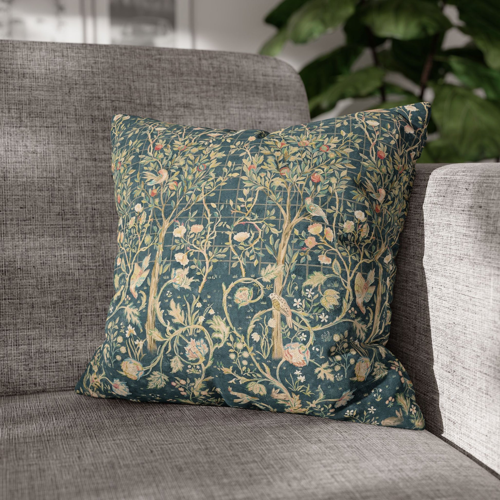 Decorative pillow with floral pattern on a gray sofa