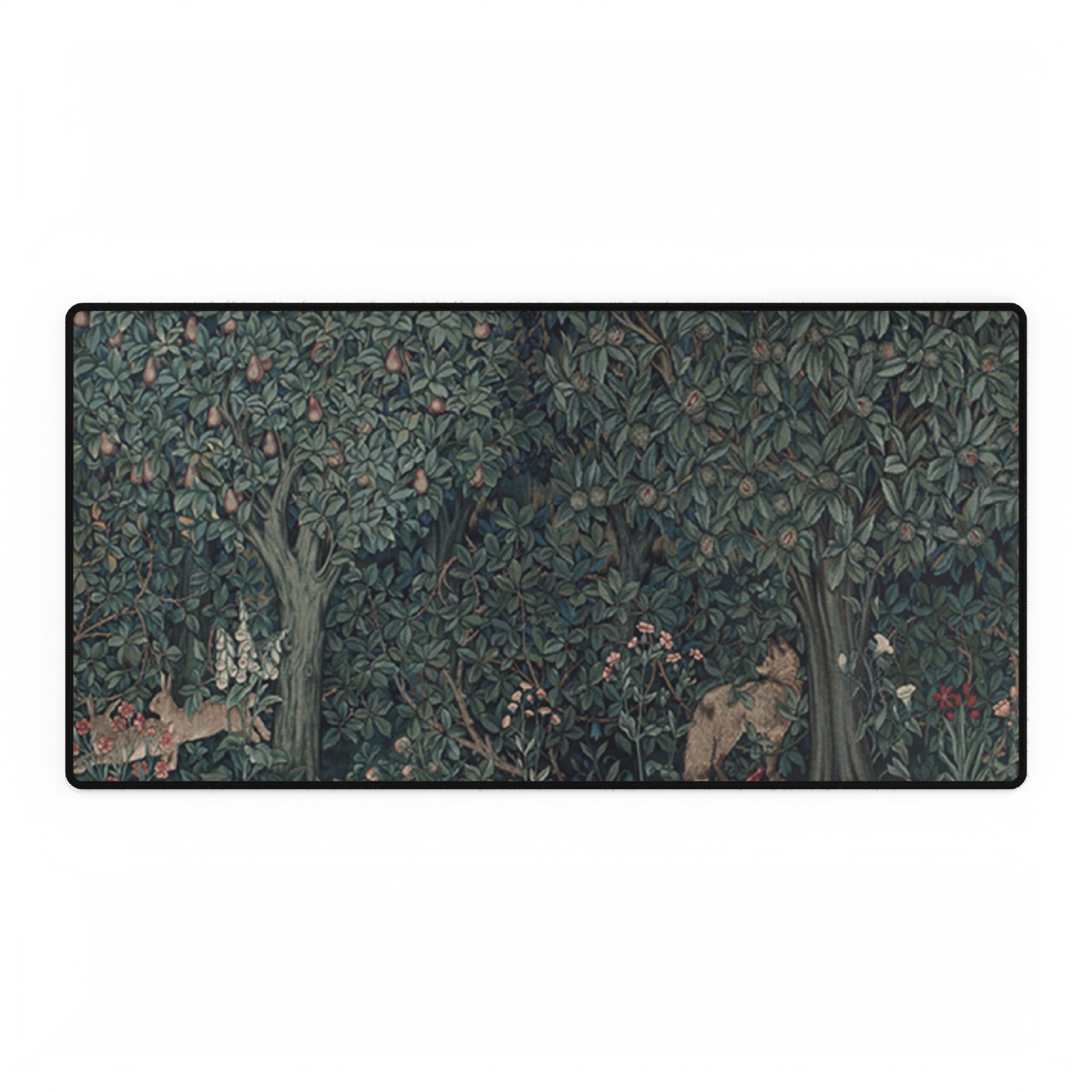 A desk mat with a floral and animal pattern, primarily in green and red colours, featuring a mouse pad on top. The desk mat has a non-slip base and is displayed in a room setting with a monitor, keyboard, and mouse.
