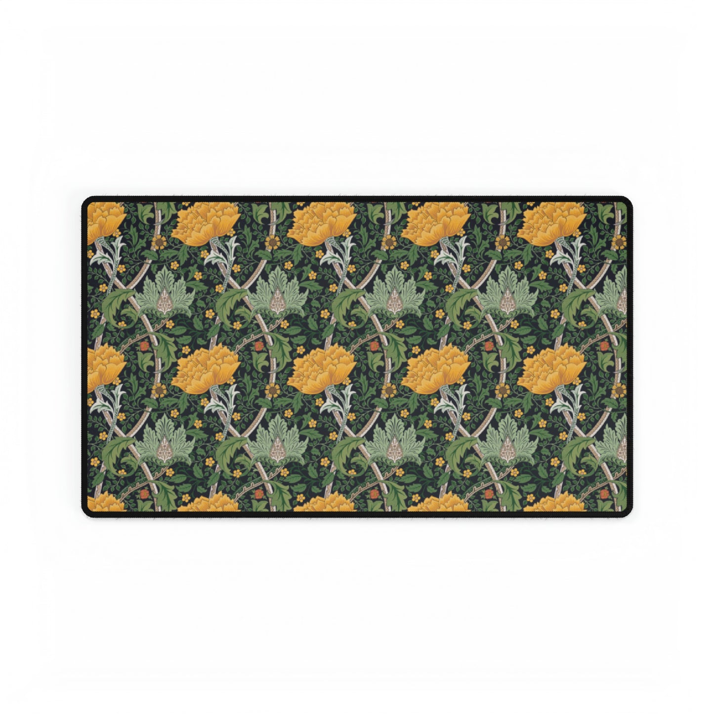A desk mat with a floral pattern, inspired by William Morris - Chrysanthemum Collection, placed under a desk with a keyboard and mouse on top.