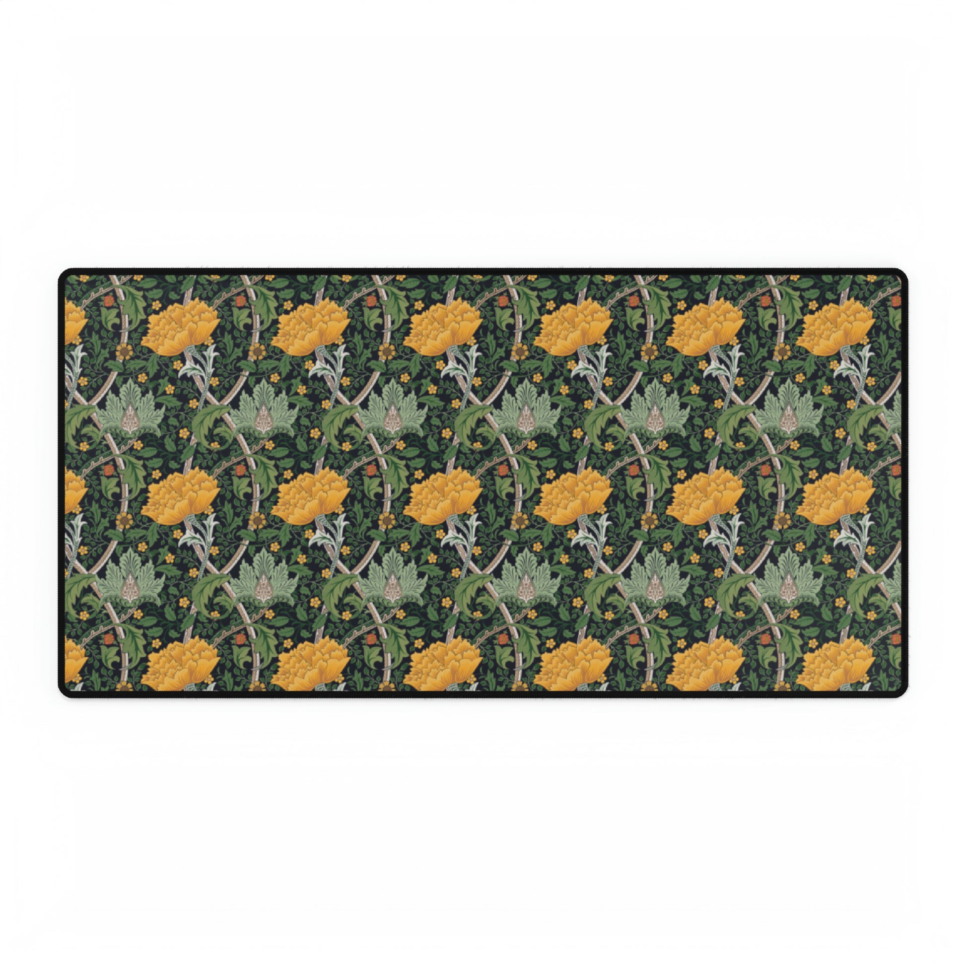 A desk mat with a floral pattern, inspired by William Morris - Chrysanthemum Collection, placed under a desk with a keyboard and mouse on top.