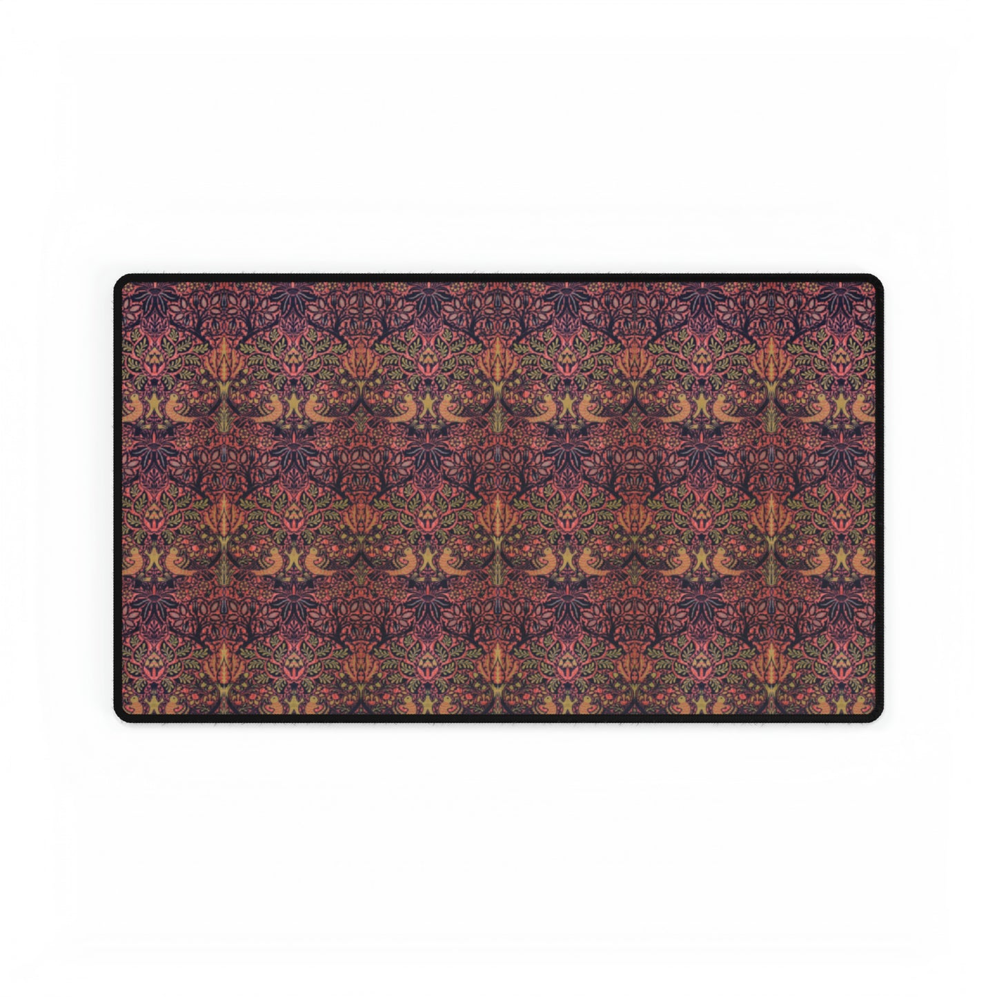 A large desk mat with a floral pattern, displayed on a desk with a keyboard and mouse, with a decorative border.