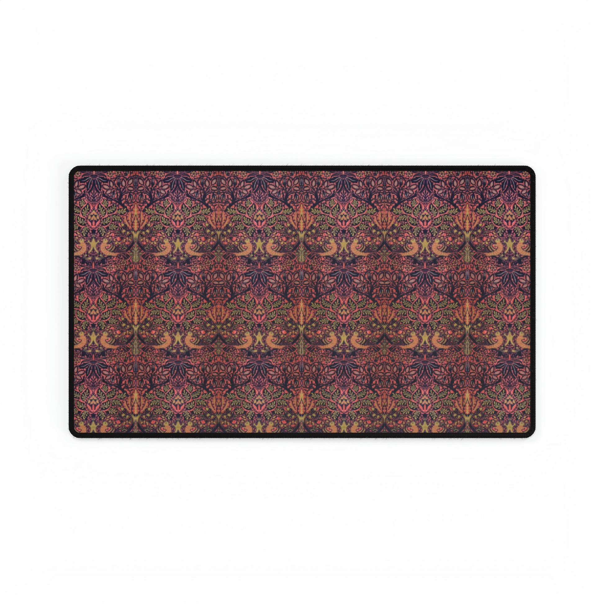 A large desk mat with a floral pattern, displayed on a desk with a keyboard and mouse, with a decorative border.
