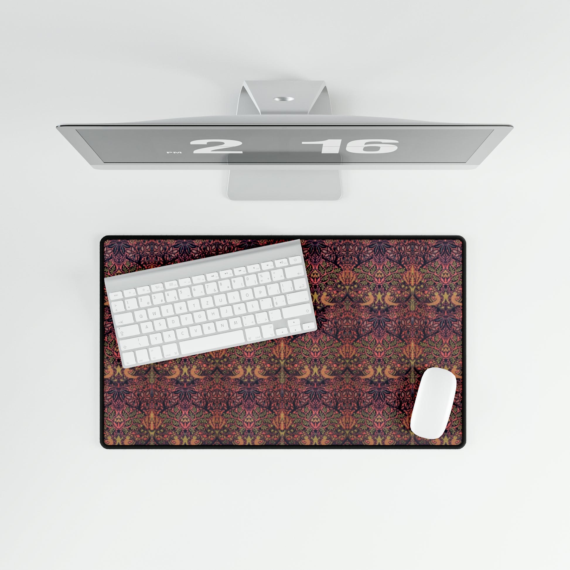 A large desk mat with a floral pattern, displayed on a desk with a keyboard and mouse, with a decorative border.